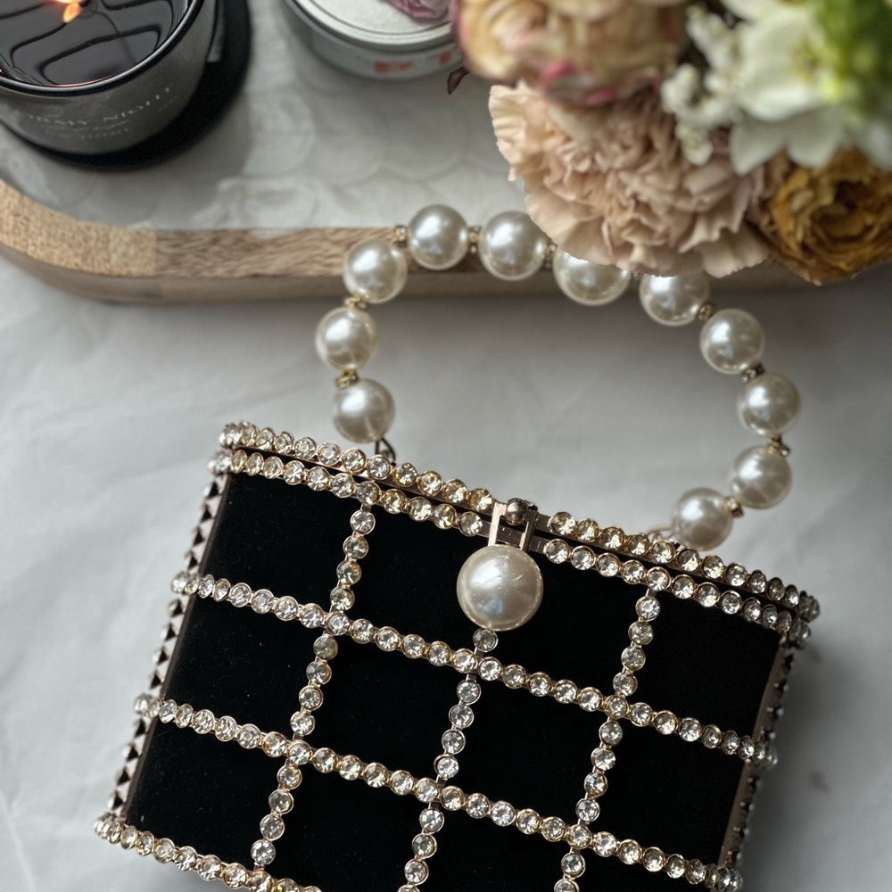 Elegant Black and Gold Mini Bag with Luxe Details